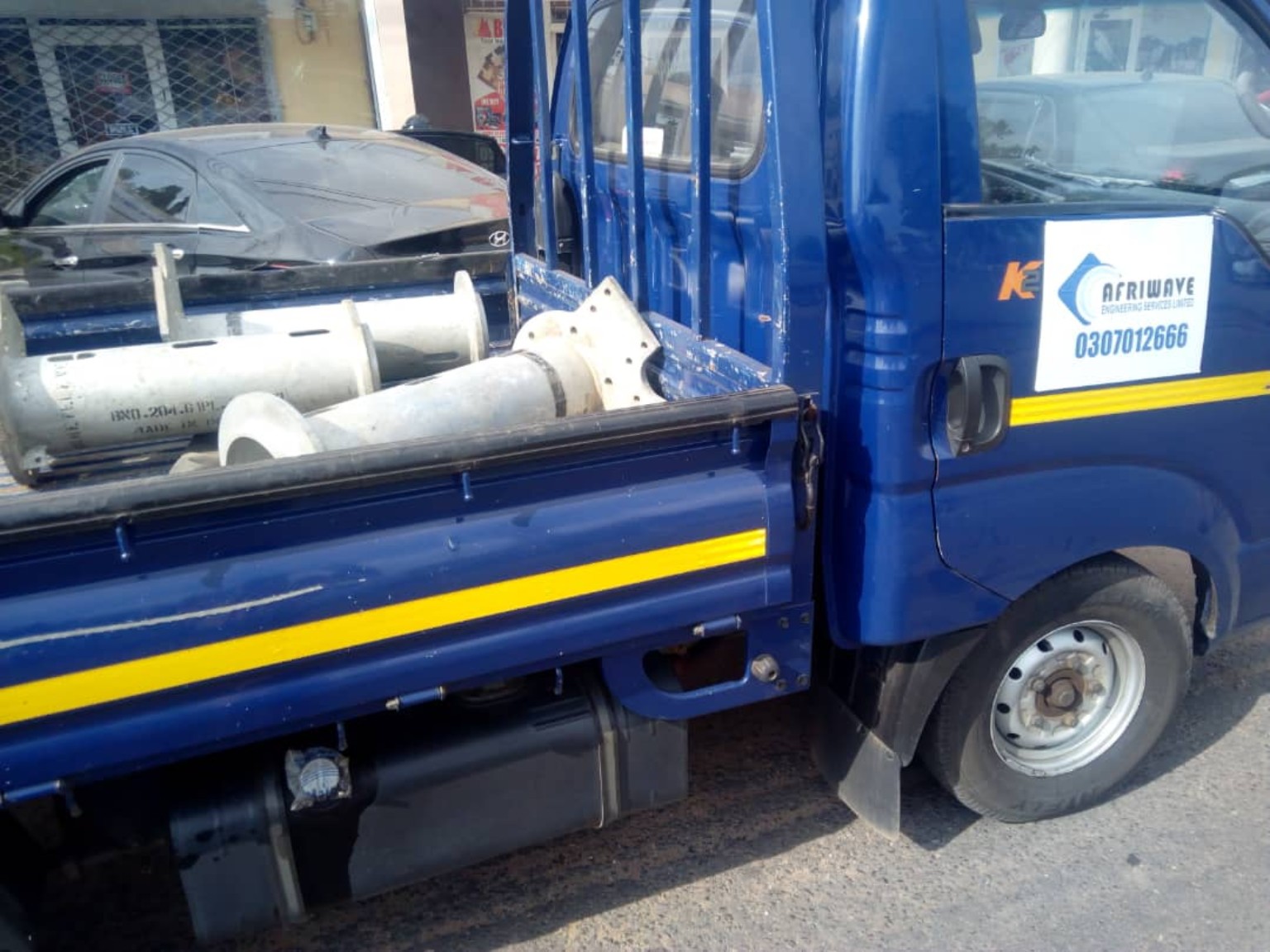 Afriwave Engineering vehicle transporting structural materials