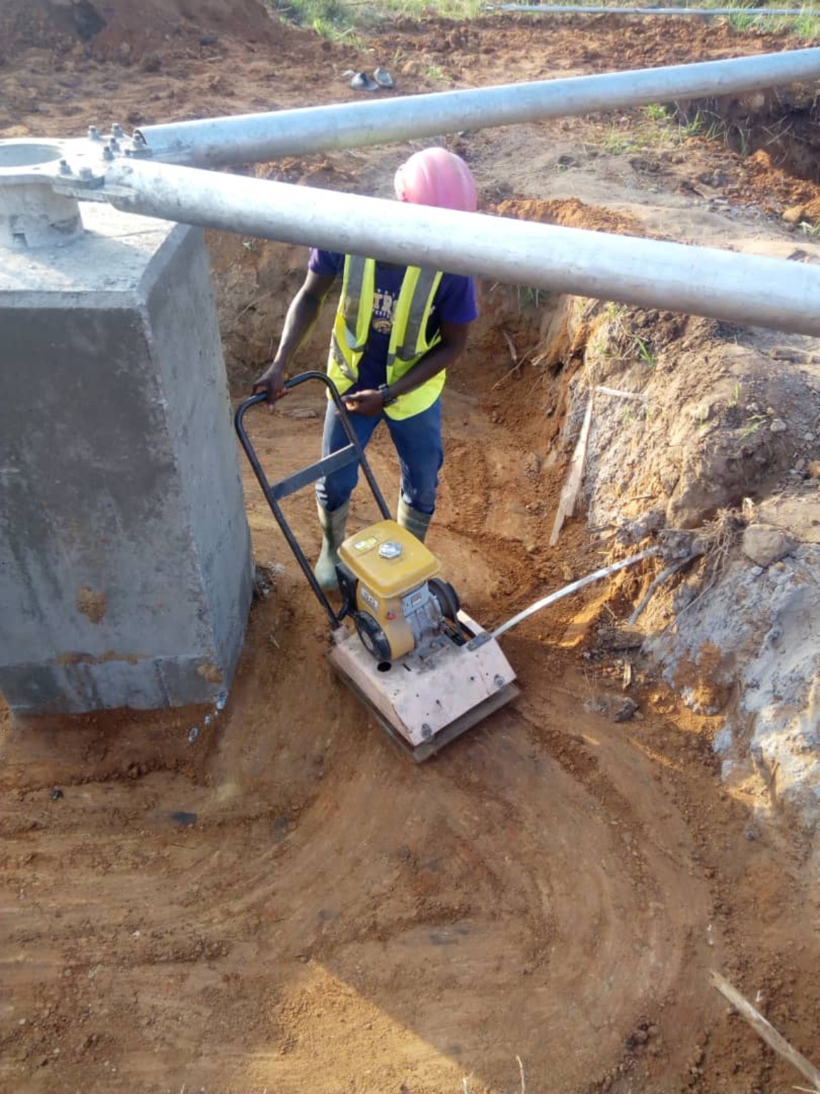 Ground compaction works beside a tower foundation