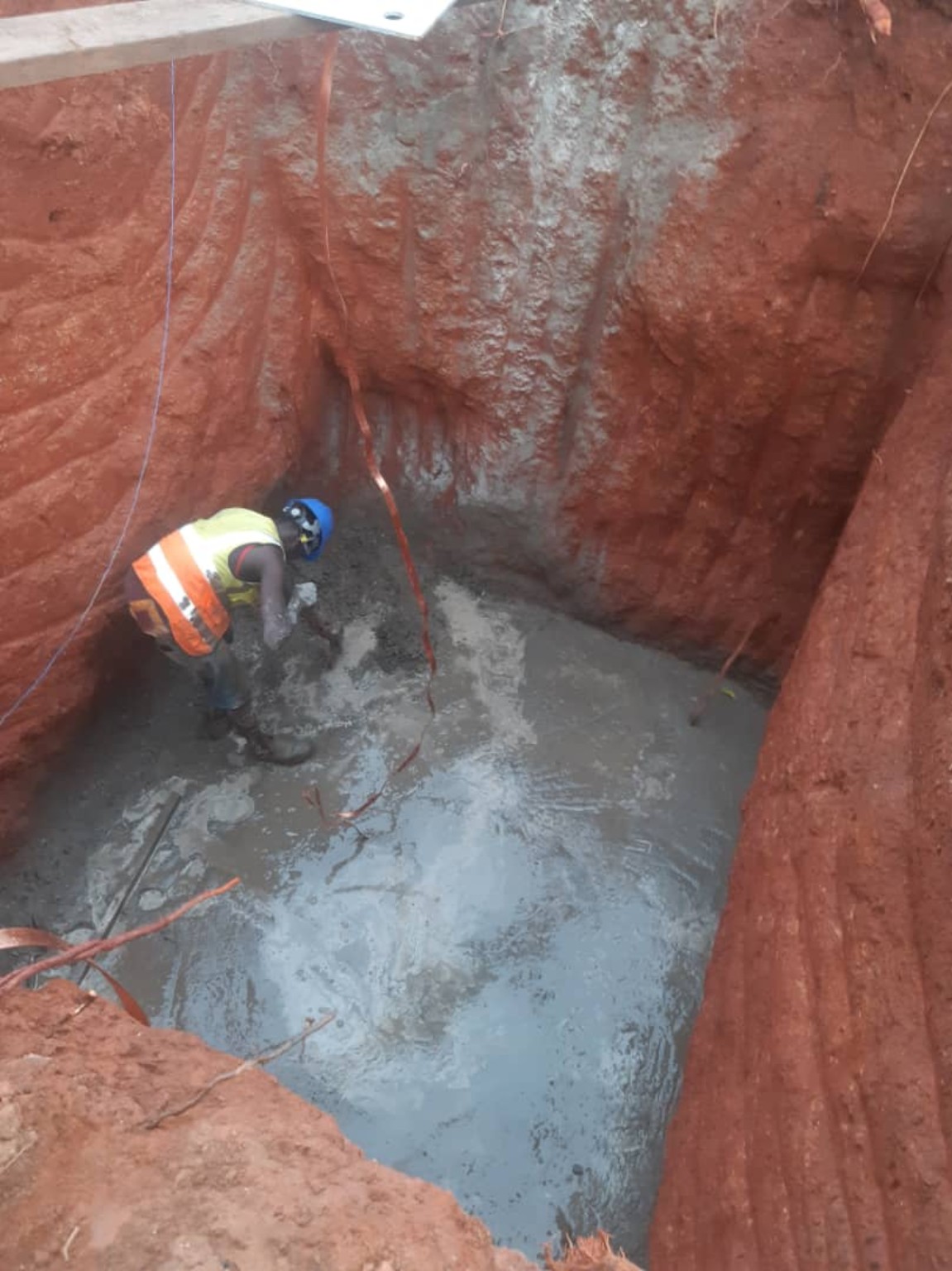 Concrete foundation works in an excavated tower base