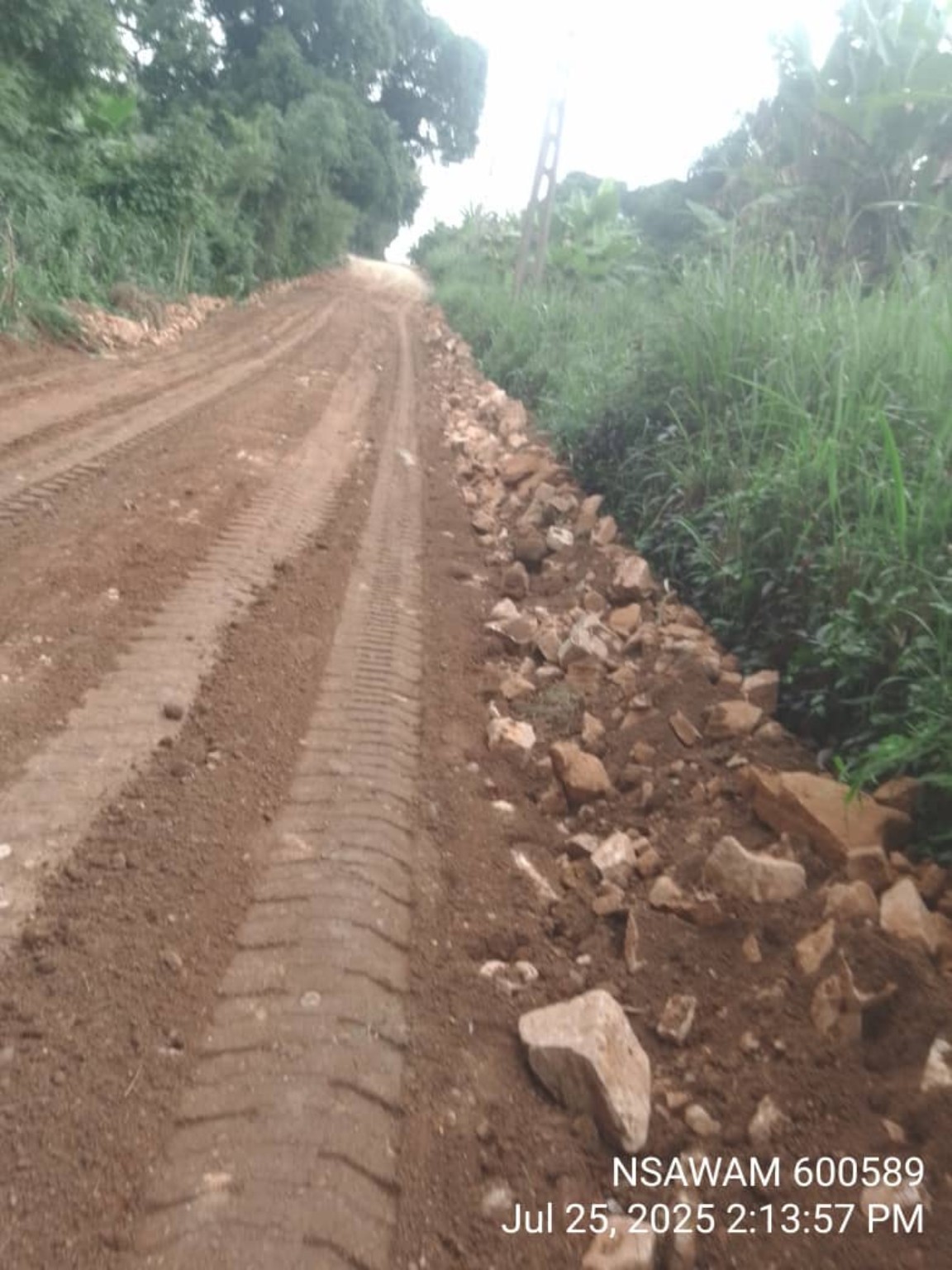 Road improvement works with site personnel and grading equipment