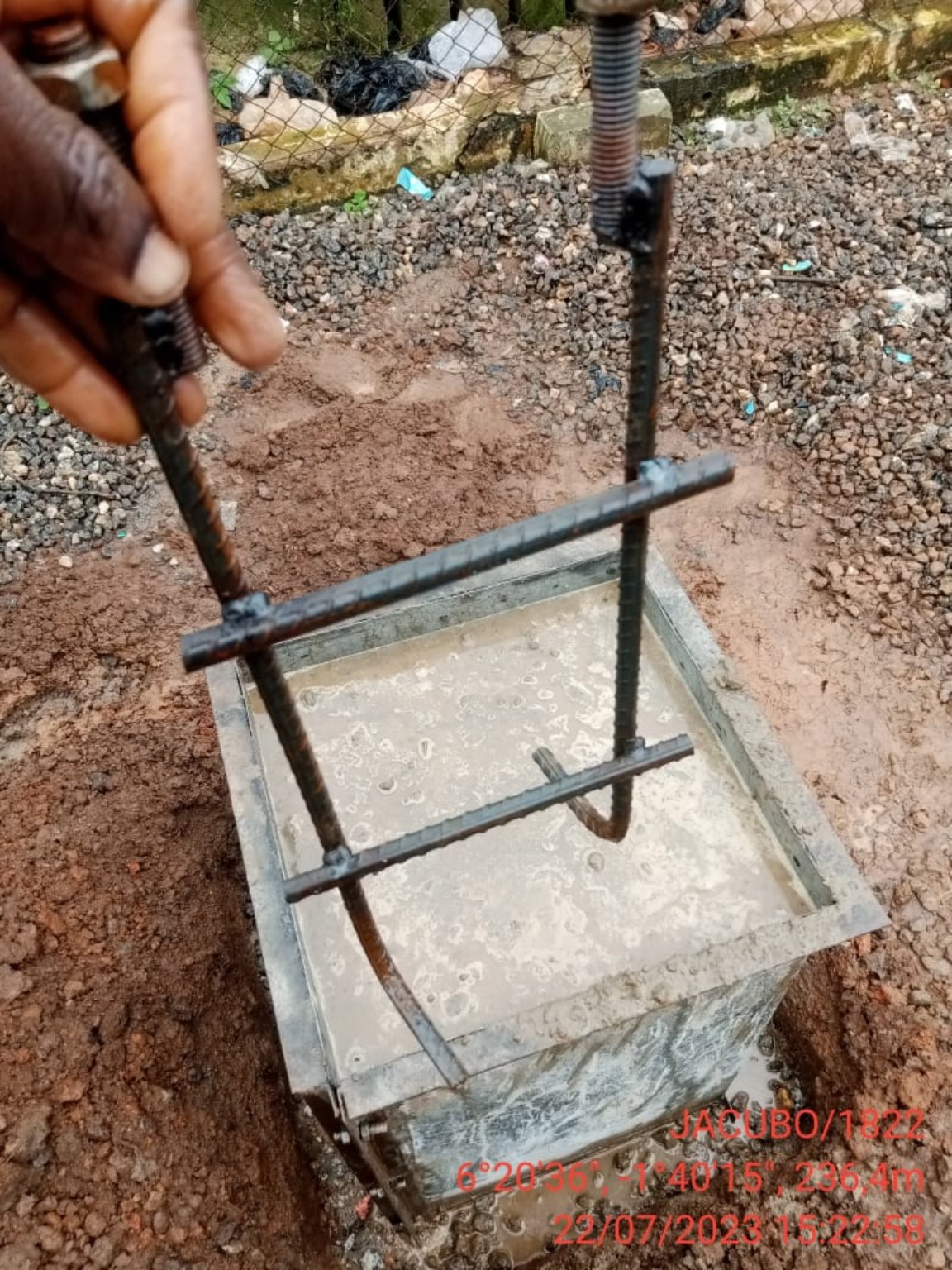 Foundation anchor assembly being positioned for installation
